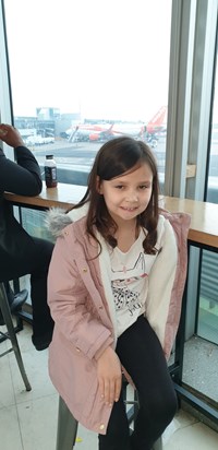 Your beautiful daughter Abigail in the airport disneyland bound. X