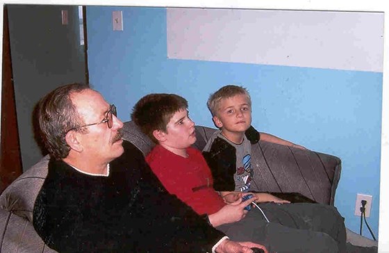 Papa, Kelsey, Dylan  playing video games.