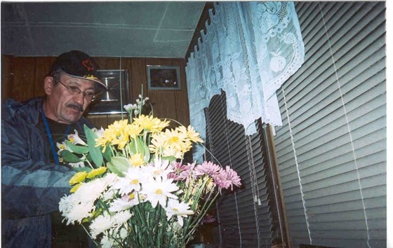 Bob surprising Carol with flowers