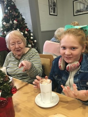 Mum telling Rebecca to drink her hot chocolate !