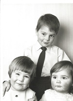 Jeremy with his two sisters
