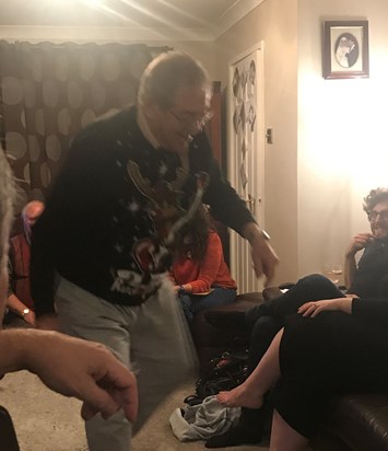 Robert enjoying charades with friends and family 