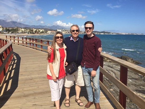 Enjoying a walk along the boardwalk in Spain. 