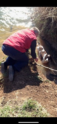 Andrew begrudgingly "saving" Monty who had kindly jumped into the river Avon.