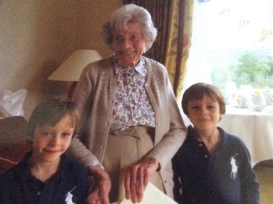 This is a picture of Doris (Smithy) at her 90th birthday celebration. She is with her two Great-Grandsons, Freddie and Ollie (me).