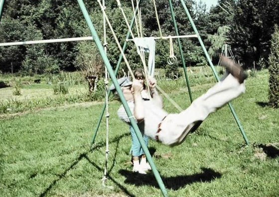 Dad on a Swing during a summer  holiday in  France