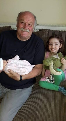 My Dad with his two granddaughters, dated 2016. 