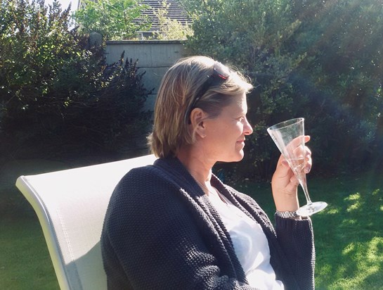 Alix enjoying a glass in the sun.