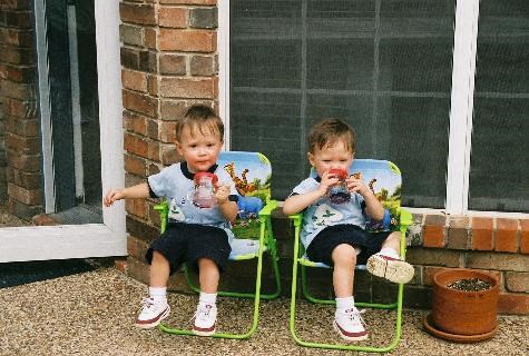 Caden and Ethan enjoying a drink outside