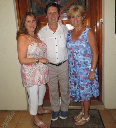 With his sisters, Debbie and Angela