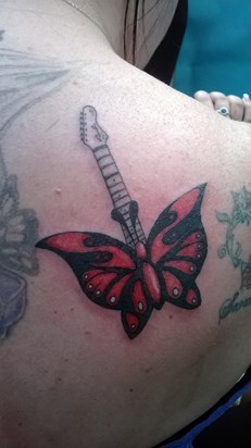 I had this done in memory of Mark. he taught me to play the guitar and the drums in school