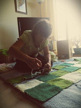 Avidly knitting and sewing Nai a blanket - Summer 2014