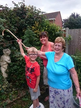 Jean with Niece Yvonne and her grandson Charlie tending the garden 