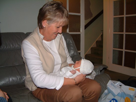 Mum holding a very new Finlay, Feb 2004