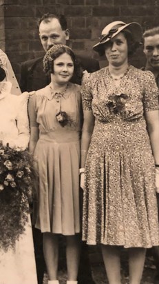 Peggy, with her mum and dad, in July 1942 at the wedding of George & Gladys Stearn
