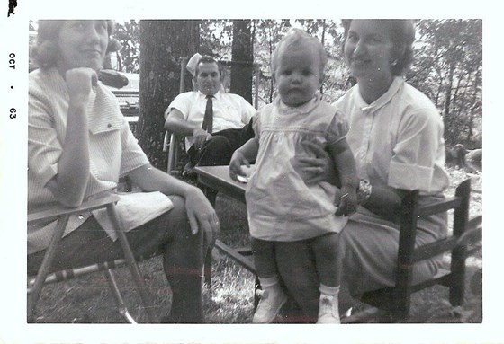 Daddy(sittin In Back), Aunt Joan to the left and Mama holing me in her lap.......