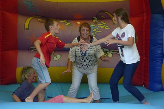 Maureen Jen Benji Candela on the bouncy castle - Kate's 40th - 02-08-2014