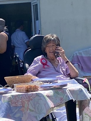 Leslie on the phone to Little Nick @75th Birthday