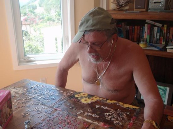 Silly Dick acting gangster while he does a puzzle in St. John Summer 2008
