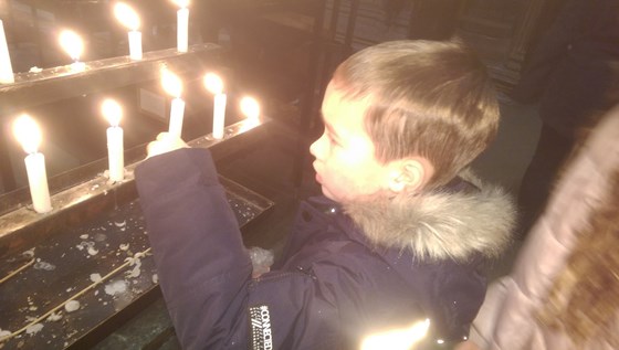 Finley lighting a candle for you at St Albans abbey 