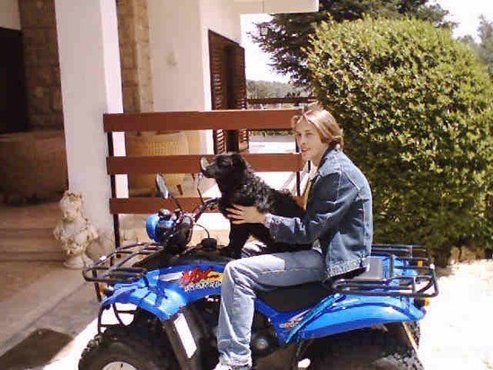 Miles with his dog Martes and his Quad bike at our home in Spain