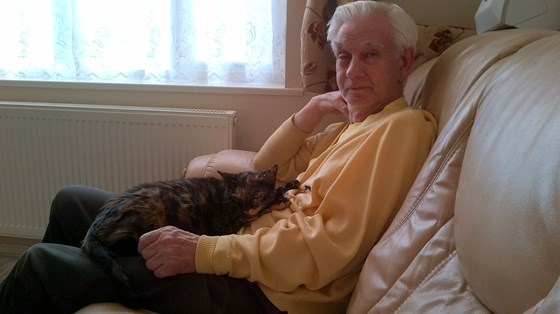 Dad at my house with Amy the cat on his lap.