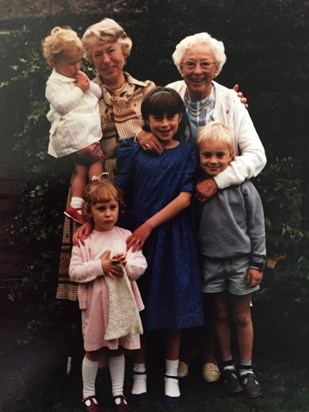 Rachel (being held) with her sister, cousins, nan and great gran.