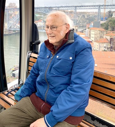 Porto, one very happy Dad on a cable car trip. We went on a river boat trip and found a traditional restaurant for lunch and later a food hall market for a beer and Pasteis de Nata custard tart.