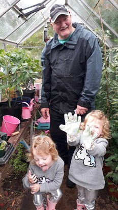 Granpa & his girls tending the tomatoes x