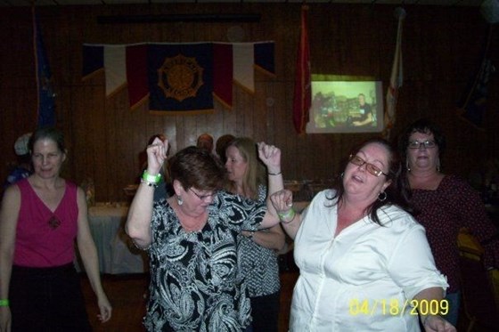 Patti Ann and Maureen dancing their hearts out for Uncle Tommy