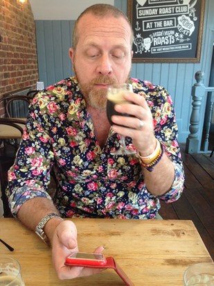 Enjoying a glass of Guinness.