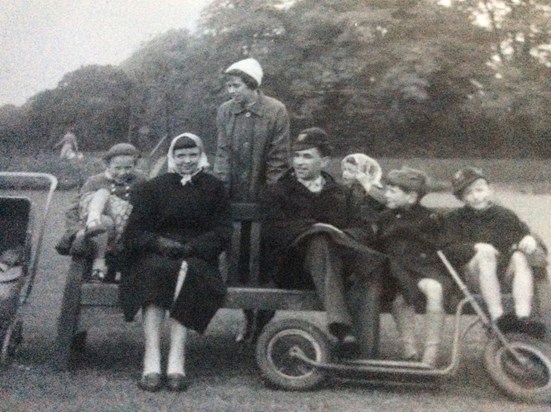 A trip to the park with her cousins...Jane sitting next to her Dad