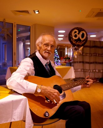 My father making a joyful sound, with one of his guitars he loved playing, here celebrating at his 60th wedding annniversary. Love Kieron x