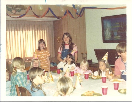 1970s Darrell far right, Lori standing on his right & I'm the Birthday girl at head of the table.