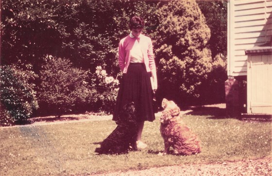 Gay in the garden of Anngay, Virginia Water, with dogs Rastas and Buffer, November 1955, Gay aged 21