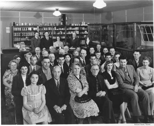 Dick (2nd row from front) behind lady in blk dress May 20, 1948 J. R. Watkins Mtg. 8408 Pacific Ave