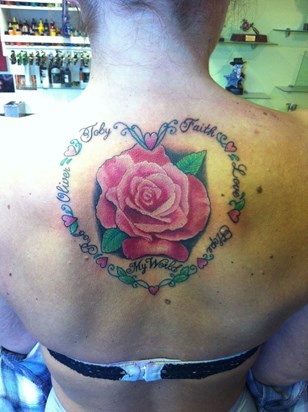 Aleasha had a tattoo done stating our names and love, faith, hope.