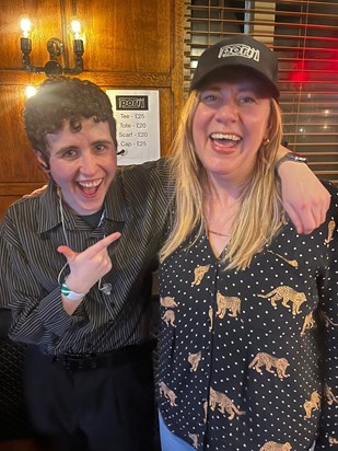 Isabelle buying her much-loved Porij cap at the Porij gig in Cambridge, January 2024 (pictured here with lead singer Egg) 