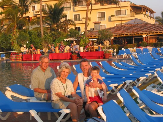 Enjoying the late afternoon sun, son and grandson at Velas in 2003