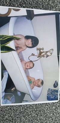 Three cheeky monkeys in the bath