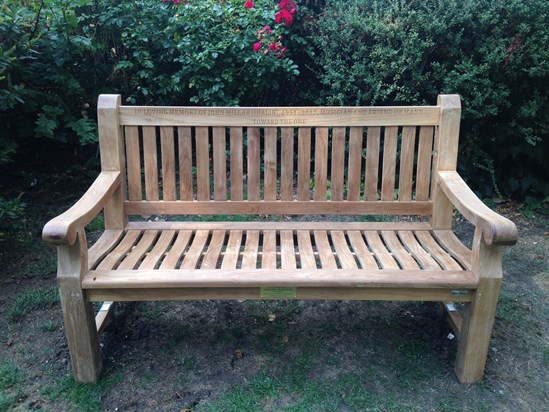 The bench in memory of Jhalib in the public church garden at St Peter's Belsize Park, London NW3 