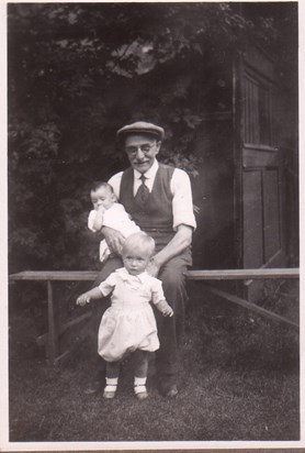 Grandfather Henry Court holding baby Audrey, with cousin Billy
