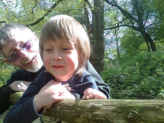 Gerry teaching Alex how to climb in the woods above our canal