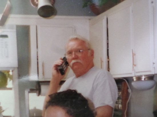 Glen on the phone at home