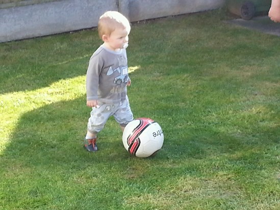 Having a Kick around in the garden with Daddy