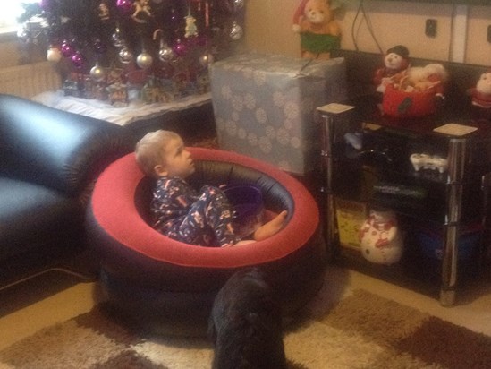 Chillaxin at christmas in his new chair with his box of choccies, happy as Larry lol