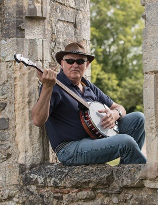 Learning to play the banjo at Titchfield Abbey, Hampshire