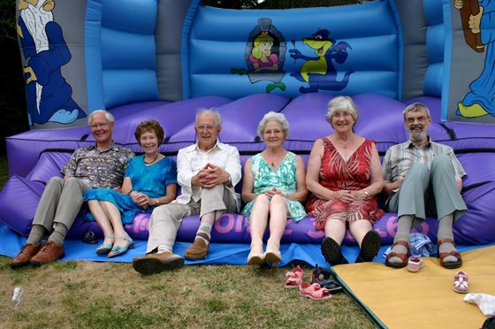 Rupert, Rosalind, Mike, Valerie, Judith and David on the bouncy castle at the Kipping family get-together