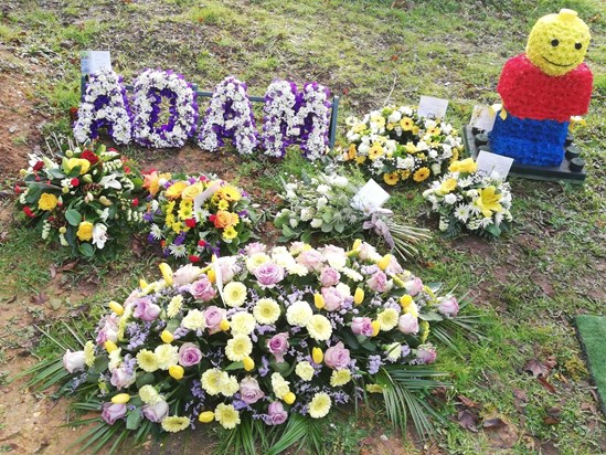 Floral tributes for Adam