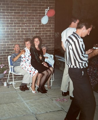 Ann sitting on her dads knee, me sitting on Ann Nees knee. 1989